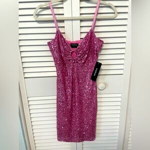 Adorable sequin BeBe dress. Never worn new with tags.